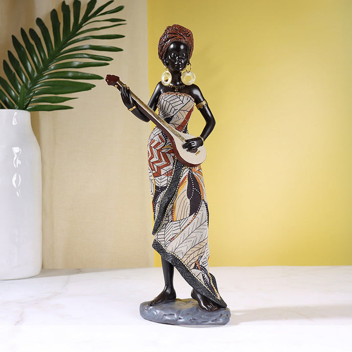 Afrikaanse vrouwelijke muzikantensculptuur