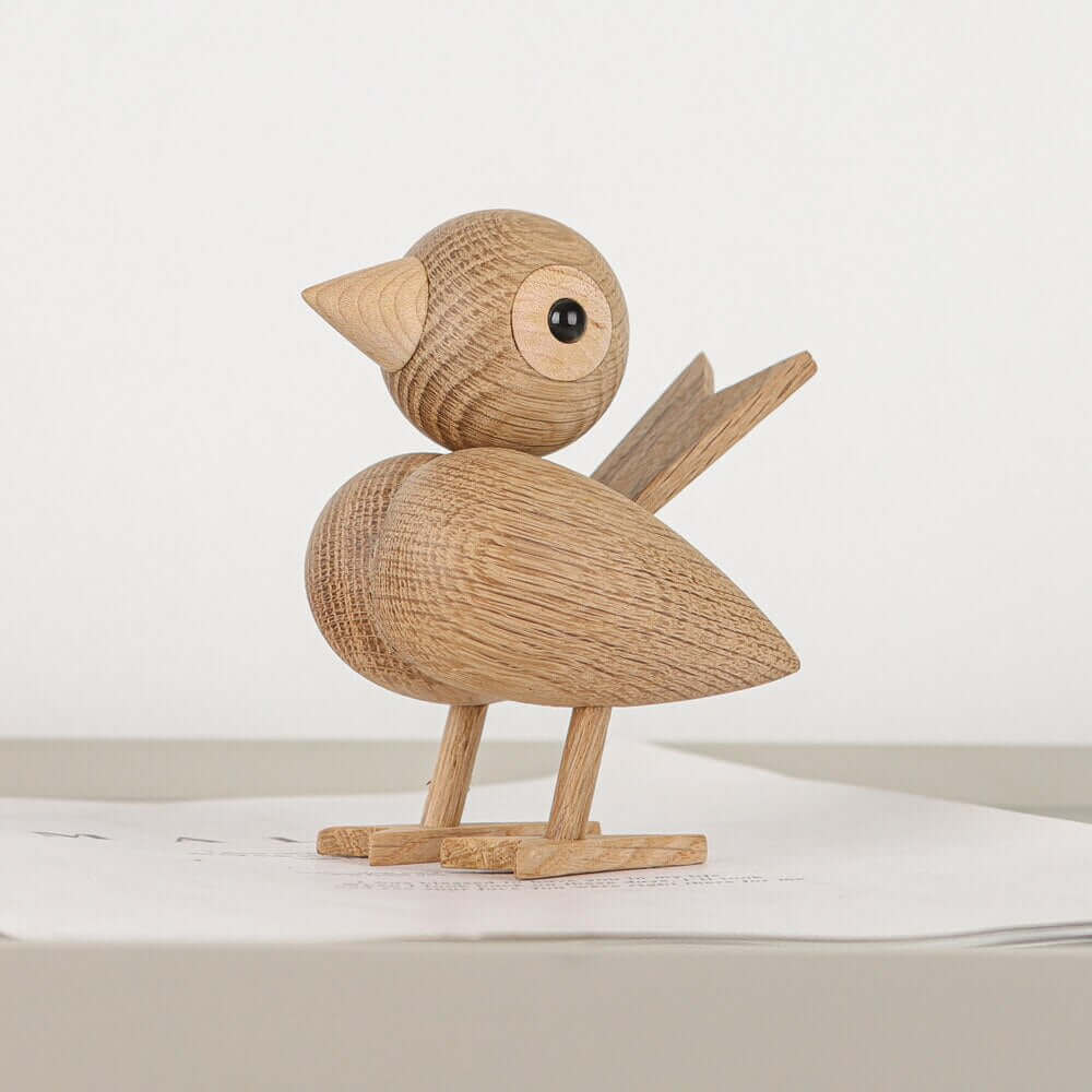 Een kleine vogel vertelde het me, Noordse houten ornament