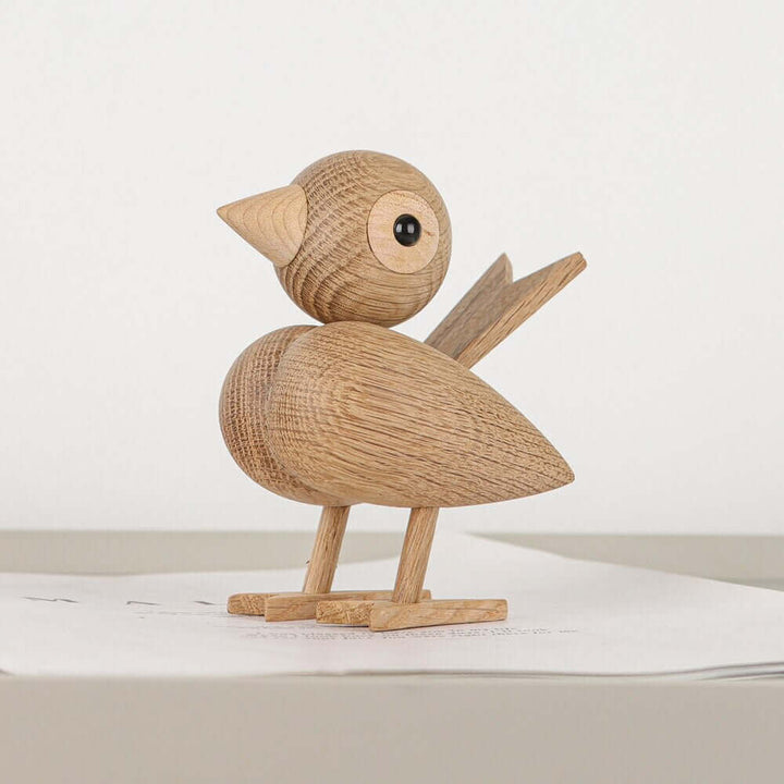 Een kleine vogel vertelde het me, Noordse houten ornament